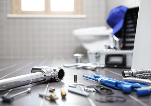 plumber tools and equipment in a bathroom, plumbing repair service, assemble and install concept